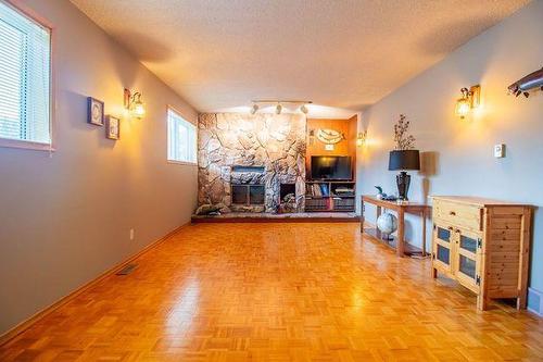 3 Playgreen Place, Arborg, MB - Indoor With Fireplace