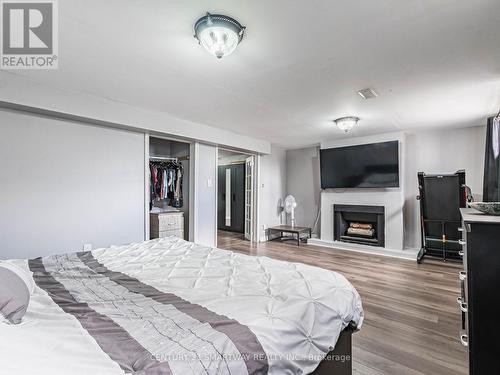 7182 Harwick Drive, Mississauga, ON - Indoor Photo Showing Bedroom With Fireplace