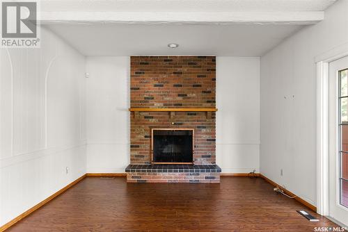 6 Wood Crescent, Regina, SK - Indoor Photo Showing Living Room With Fireplace