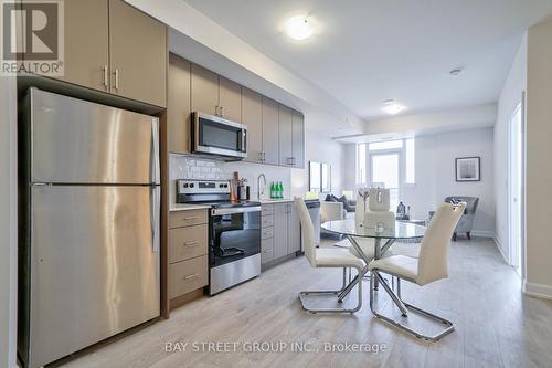 813 - 3200 William Coltson Avenue, Oakville, ON - Indoor Photo Showing Kitchen With Stainless Steel Kitchen