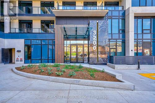 813 - 3200 William Coltson Avenue, Oakville, ON - Outdoor With Balcony With Facade