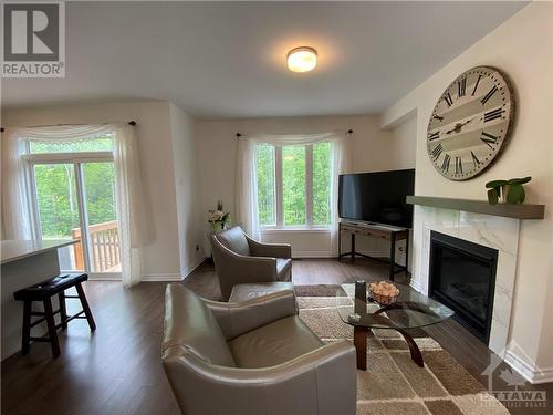 655 Persimmon Way, Ottawa, ON - Indoor Photo Showing Living Room With Fireplace