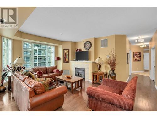 1128 Sunset Drive Unit# 407, Kelowna, BC - Indoor Photo Showing Living Room With Fireplace