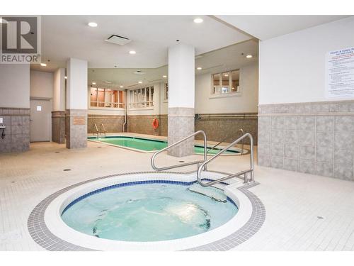 1128 Sunset Drive Unit# 407, Kelowna, BC - Indoor Photo Showing Other Room With In Ground Pool