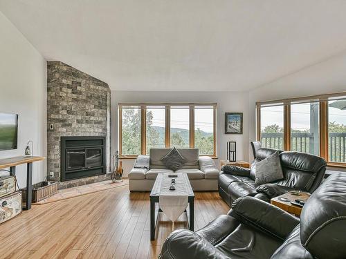 Living room - 16-330 Rue De La Grande-Corniche, Sainte-Adèle, QC - Indoor Photo Showing Living Room With Fireplace