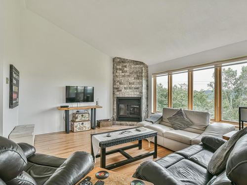 Living room - 16-330 Rue De La Grande-Corniche, Sainte-Adèle, QC - Indoor Photo Showing Living Room With Fireplace