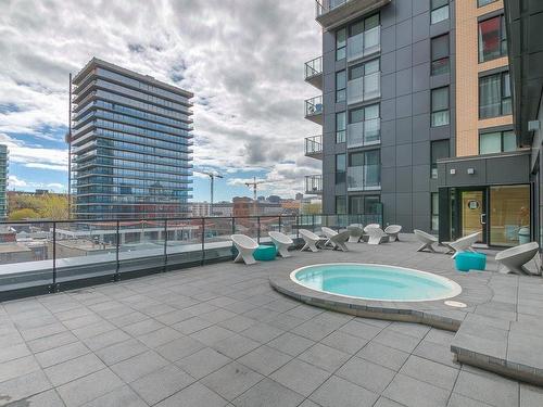 Spa - 716-235 Rue Peel, Montréal (Le Sud-Ouest), QC - Outdoor With In Ground Pool