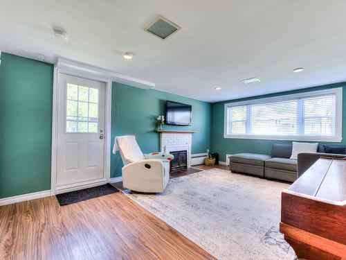 Family room - 23 Av. Summerhill, Pointe-Claire, QC - Indoor Photo Showing Living Room With Fireplace