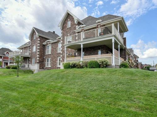 FaÃ§ade - 331 Rue De Barcelone, Dollard-Des-Ormeaux, QC - Outdoor With Balcony With Deck Patio Veranda With Facade