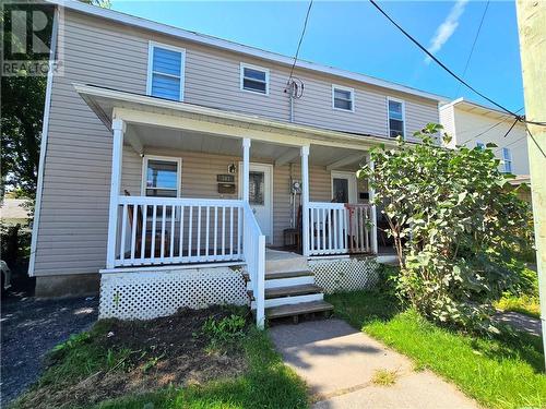 This side by side duplex offers a vacant unit and one that is currently rented. A possibility for ower occupied. - 307-309 Prince Arthur Street, Cornwall, ON - Outdoor With Deck Patio Veranda