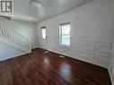 This is the living room of the vacant unit. Notice the newly added woodwork on the walls creating a modern, architectural vibe. There is new flooring installed throughtout. - 307-309 Prince Arthur Street, Cornwall, ON  - Indoor Photo Showing Other Room 