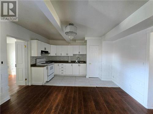 The large kitchen with plenty of cupboard space. - 307-309 Prince Arthur Street, Cornwall, ON - Indoor Photo Showing Kitchen