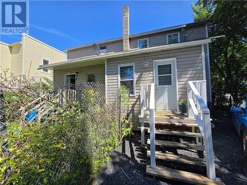 The back view of the duplex. - 307-309 Prince Arthur Street, Cornwall, ON - Outdoor With Deck Patio Veranda