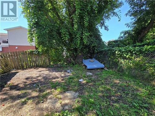 There is parking space in the back for two cars as well as driveway parking. This photo shows the vacant side. There is a more space behind the tenanted side which is currently used as  garden. - 307-309 Prince Arthur Street, Cornwall, ON - Outdoor