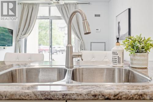 111 - 35 Southshore Crescent, Hamilton (Stoney Creek), ON - Indoor Photo Showing Kitchen With Double Sink