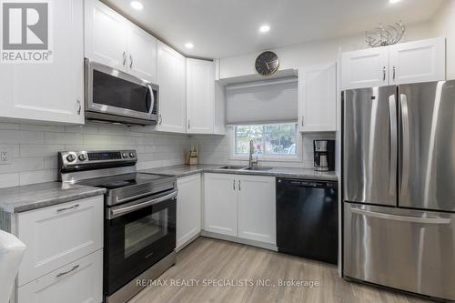 22 - 8136 Coventry Road, Niagara Falls, ON - Indoor Photo Showing Kitchen With Double Sink