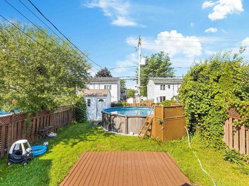 Cour - 303 Rue P.-É.-Borduas, Laval (Sainte-Rose), QC - Outdoor With Above Ground Pool With Backyard