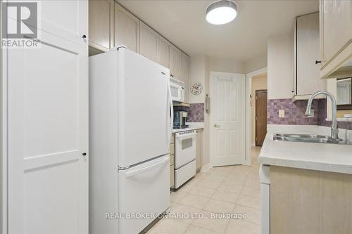 101 - 350 Mill Road, Toronto (Eringate-Centennial-West Deane), ON - Indoor Photo Showing Kitchen With Double Sink