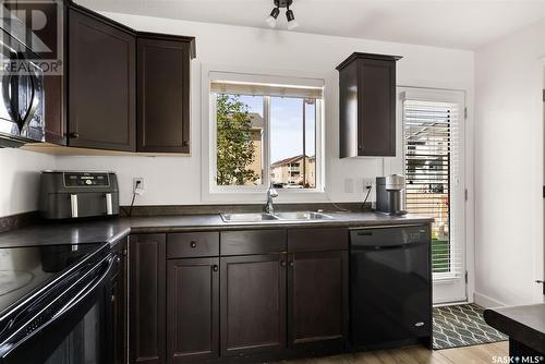 62 4850 Harbour Landing Drive, Regina, SK - Indoor Photo Showing Kitchen With Double Sink