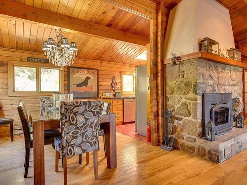 Salle Ã  manger - 10 Rue Jean, Morin-Heights, QC - Indoor Photo Showing Dining Room With Fireplace