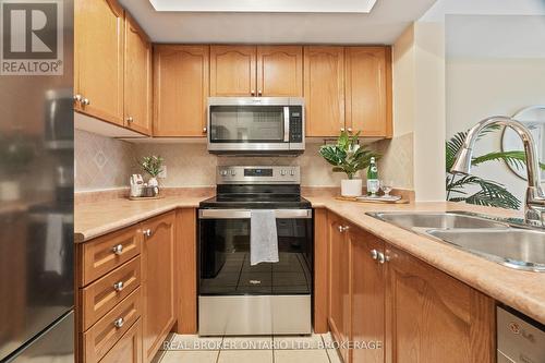 2066 - 3047 Finch Avenue W, Toronto, ON - Indoor Photo Showing Kitchen With Double Sink