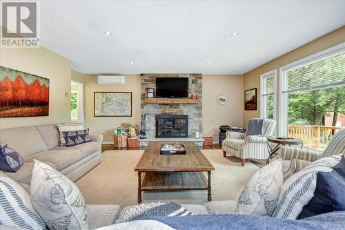 1170-A Dam Road, Hastings Highlands, ON - Indoor Photo Showing Living Room With Fireplace