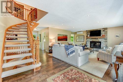 1170-A Dam Road, Hastings Highlands, ON - Indoor Photo Showing Living Room With Fireplace