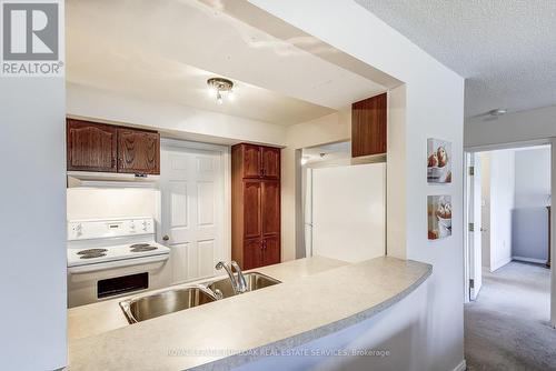 B403 - 216 Plains Road W, Burlington, ON - Indoor Photo Showing Kitchen With Double Sink