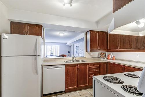 216 Plains Road W|Unit #403B, Burlington, ON - Indoor Photo Showing Kitchen With Double Sink