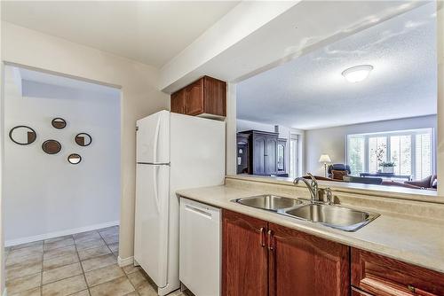 216 Plains Road W|Unit #403B, Burlington, ON - Indoor Photo Showing Kitchen With Double Sink