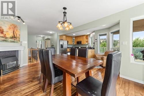 113 Christie Mountain Lane, Okanagan Falls, BC - Indoor Photo Showing Dining Room With Fireplace