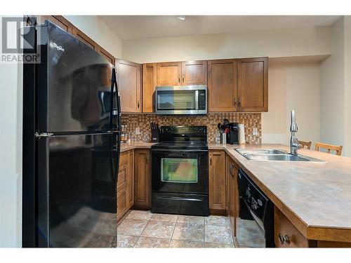 654 Cook Road Unit# 242, Kelowna, BC - Indoor Photo Showing Kitchen With Double Sink