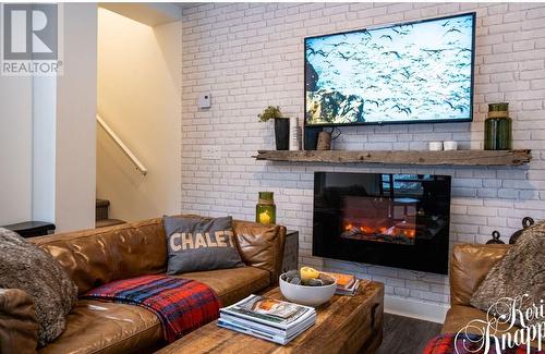 1901 Nels Nelson Crescent Unit# 3100, Revelstoke, BC - Indoor Photo Showing Living Room With Fireplace