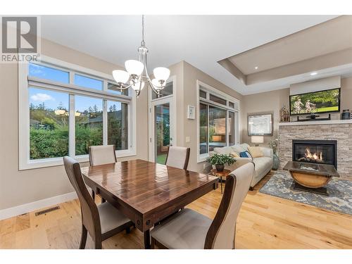 13117 Porter Drive, Lake Country, BC - Indoor Photo Showing Dining Room With Fireplace