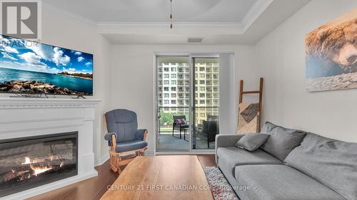 1010 - 330 Ridout Street N, London, ON - Indoor Photo Showing Living Room With Fireplace