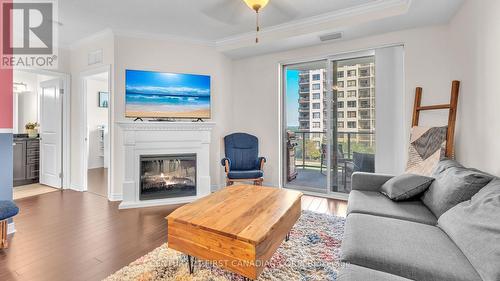 1010 - 330 Ridout Street N, London, ON - Indoor Photo Showing Living Room With Fireplace