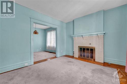 23 Bellwood Avenue, Ottawa, ON - Indoor Photo Showing Living Room With Fireplace