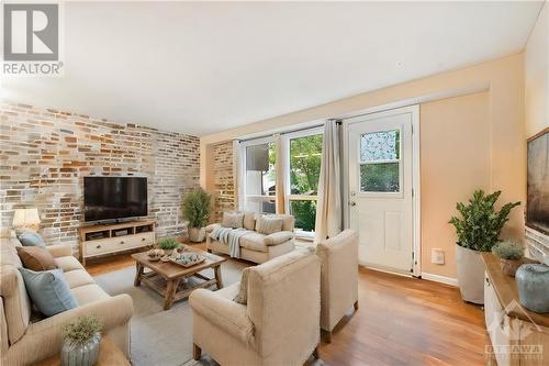 This photo has been virtually staged. - 1500 Lassiter Terrace, Ottawa, ON - Indoor Photo Showing Living Room