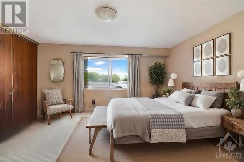 This photo has been virtually staged. - 1500 Lassiter Terrace, Ottawa, ON - Indoor Photo Showing Bedroom