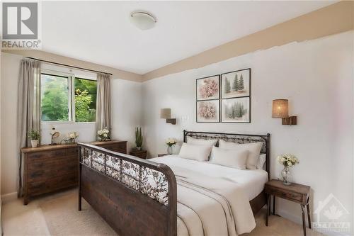 This photo has been virtually staged. - 1500 Lassiter Terrace, Ottawa, ON - Indoor Photo Showing Bedroom