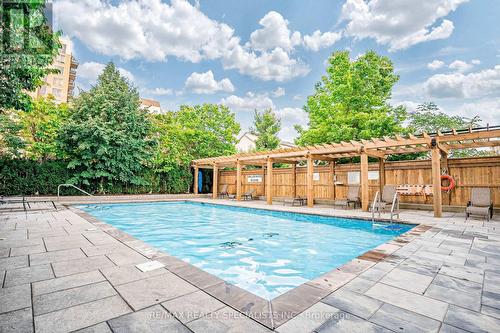 412 - 2365 Central Park Drive, Oakville, ON - Outdoor With In Ground Pool