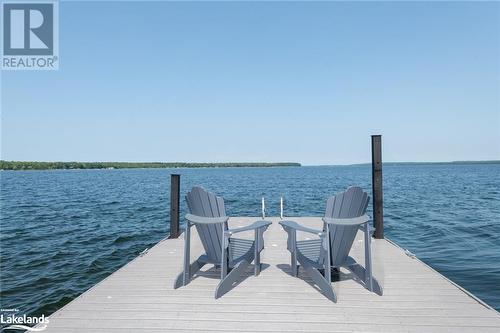 Beausoleil Island is in the distance right of the dock - 132 Gilwood Park Drive, Penetanguishene, ON - Outdoor With Body Of Water With View