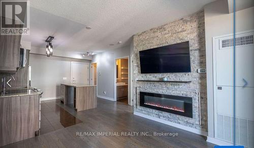 Ne1510 - 9205 Yonge Street, Richmond Hill, ON - Indoor Photo Showing Living Room With Fireplace