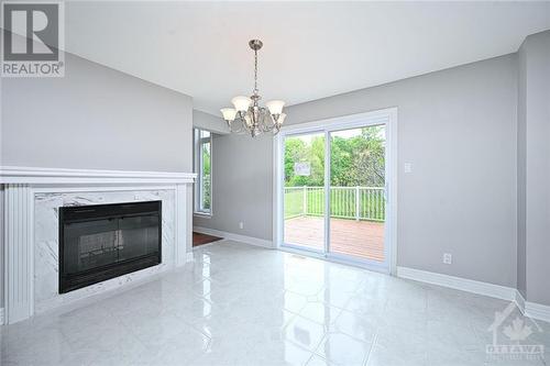 kitchen - 38 Knudson Drive, Ottawa, ON - Indoor Photo Showing Living Room With Fireplace