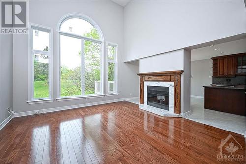 family room - 38 Knudson Drive, Ottawa, ON - Indoor Photo Showing Living Room With Fireplace