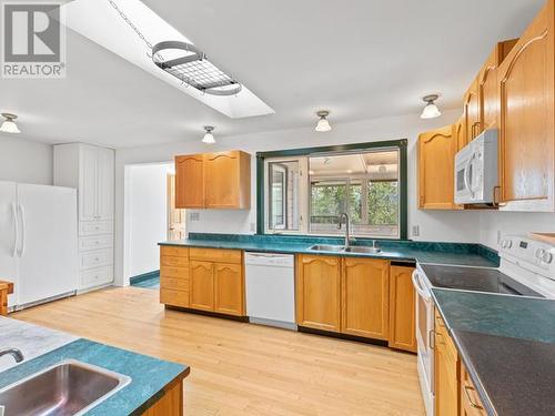 56 Tamarack Drive, Whitehorse, YT - Indoor Photo Showing Kitchen With Double Sink