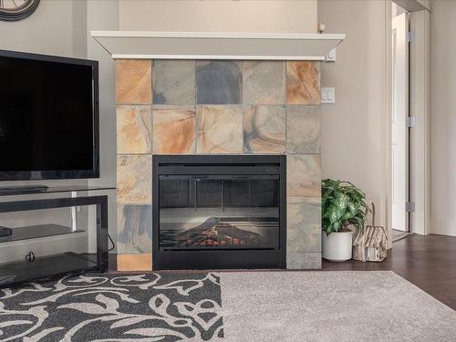 304-6310 Mcrobb Ave, Nanaimo, BC - Indoor Photo Showing Living Room With Fireplace