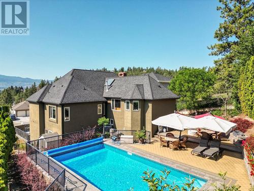 2376 Nahanni Court, Kelowna, BC - Outdoor With In Ground Pool With Deck Patio Veranda