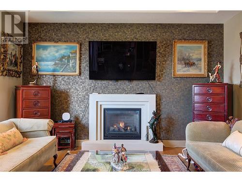 2376 Nahanni Court, Kelowna, BC - Indoor Photo Showing Living Room With Fireplace