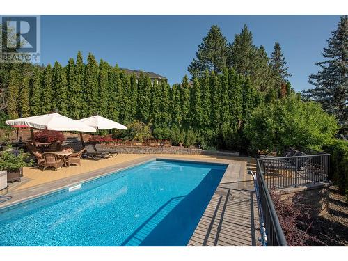 2376 Nahanni Court, Kelowna, BC - Outdoor With In Ground Pool With Deck Patio Veranda With Backyard